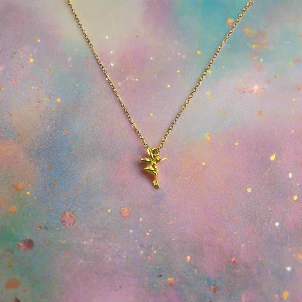 14K Gold Fairy Charm Necklace, our sweet gold fairy charm necklace has an adorable delicate petite fairy with wings, a enchanting charm, a tiny treasure to wear throughout your day.