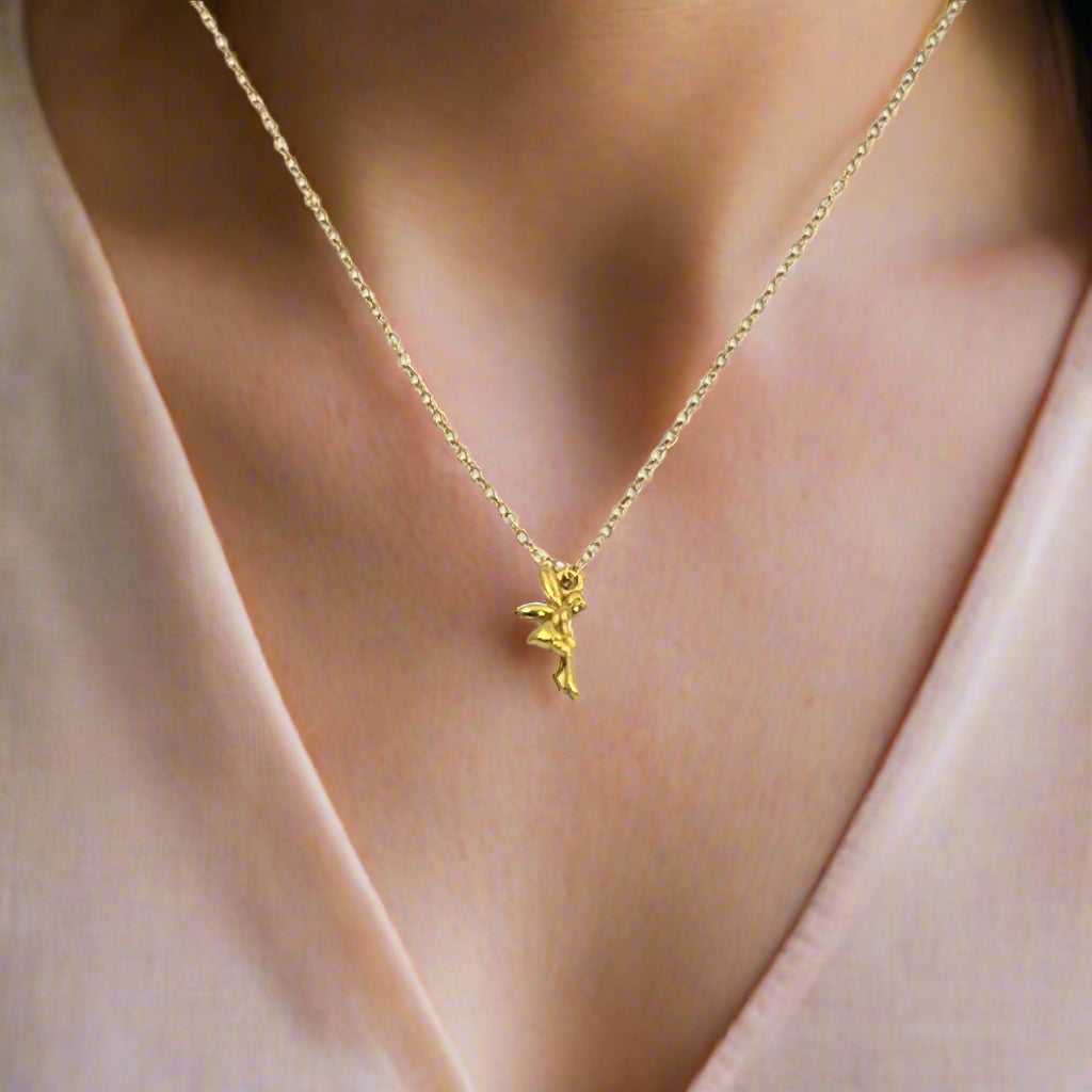 14K Gold Fairy Charm Necklace, our sweet gold fairy charm necklace has an adorable delicate petite fairy with wings, a enchanting charm, a tiny treasure to wear throughout your day.