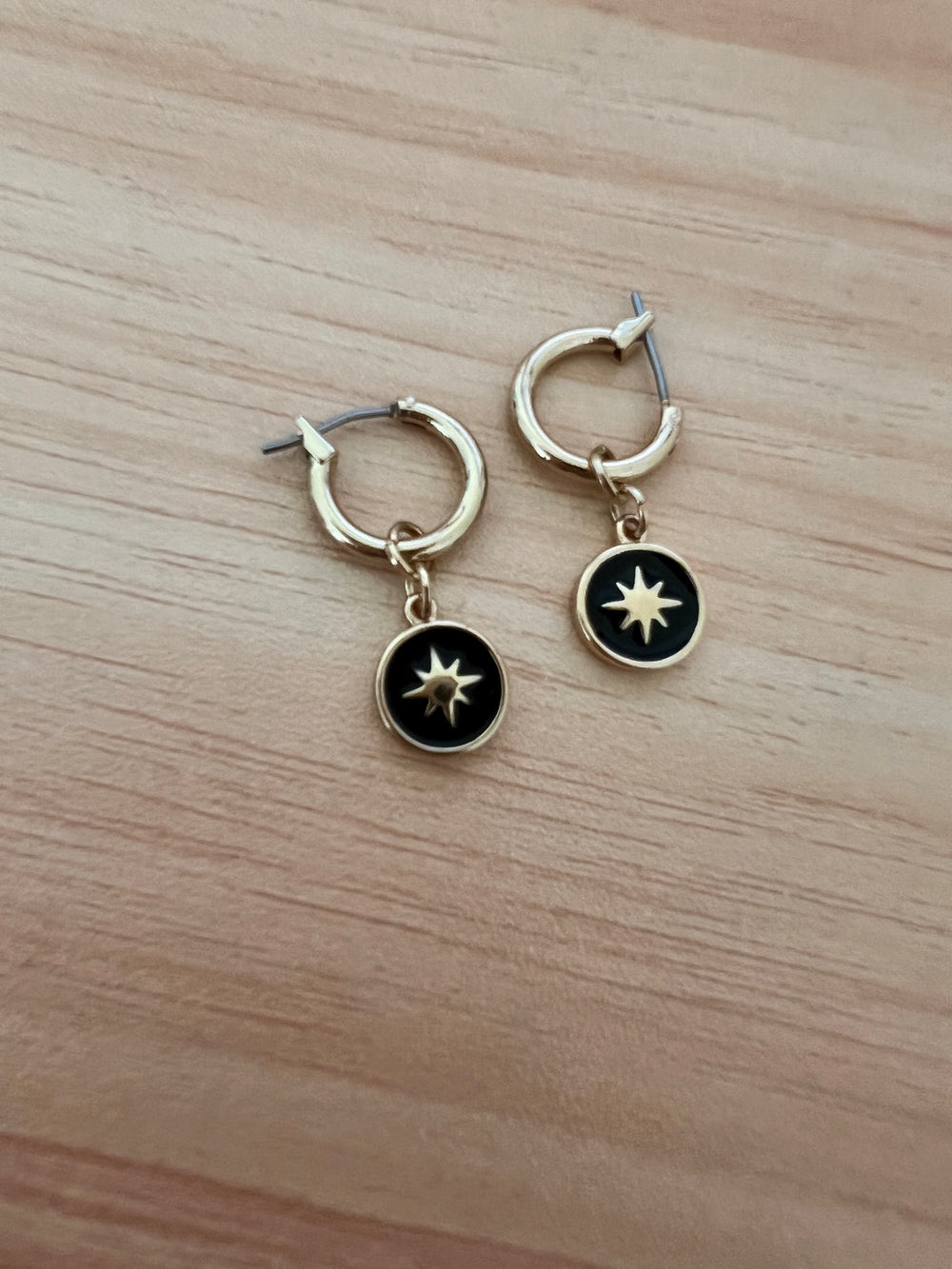 Gold Black Star Huggies Hoop Earrings, Minimalist gold star on black round charm huggie hoops designed for everyday. These 10mm hoops