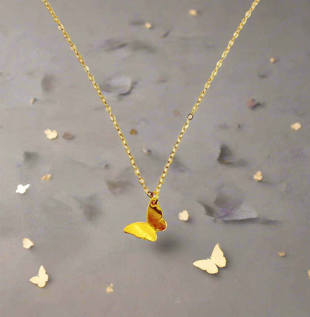 14K Gold Butterfly Charm Necklace, our tiny 14k gold butterfly necklace features a lightweight gold butterfly charm on 14k gold-filled chain, an irresistible dainty charm necklace.