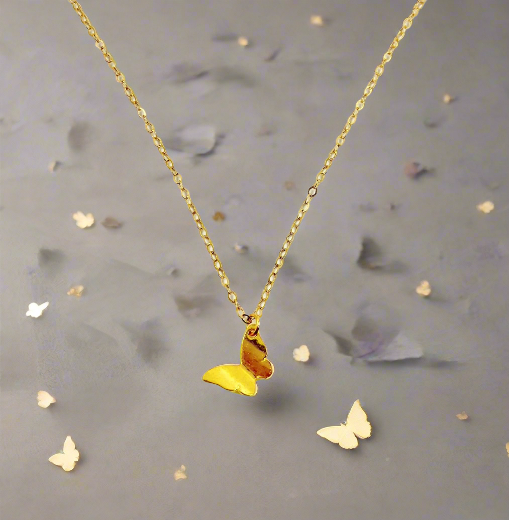 14K Gold Butterfly Charm Necklace, our tiny 14k gold butterfly necklace features a lightweight gold butterfly charm on 14k gold-filled chain, an irresistible dainty charm necklace.