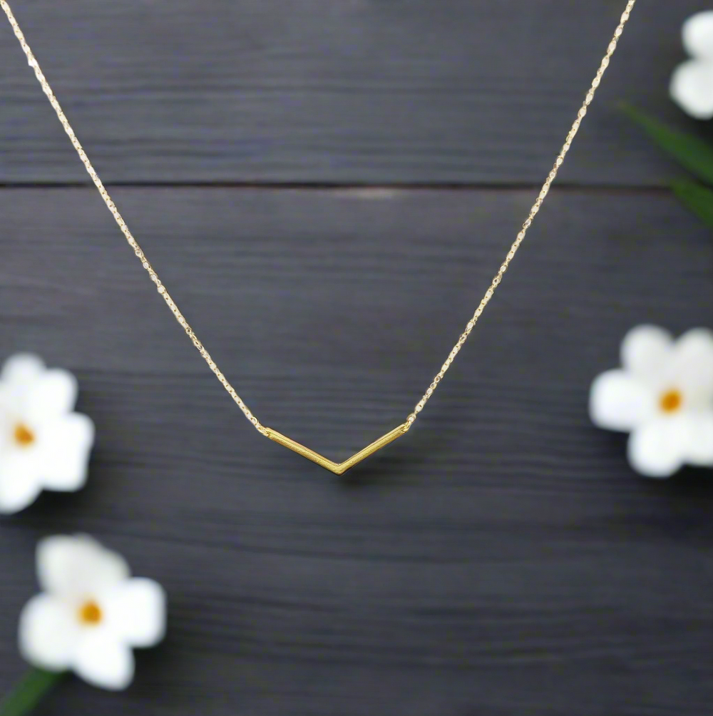 14K Gold Chevron V Bar Charm Necklace, our petite chevron V bar charm on 14k gold-filled chain equals a sweet minimalist charm necklace for everyday wear.