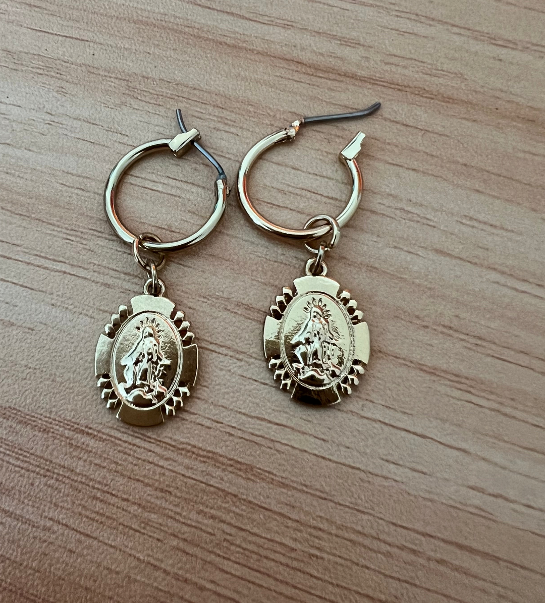 Gold Mary Medallion Huggies Hoop Earrings, Minimalist gold Mary huggie hoops designed for everyday. These 10mm hoops feature petite VM medallion charm 