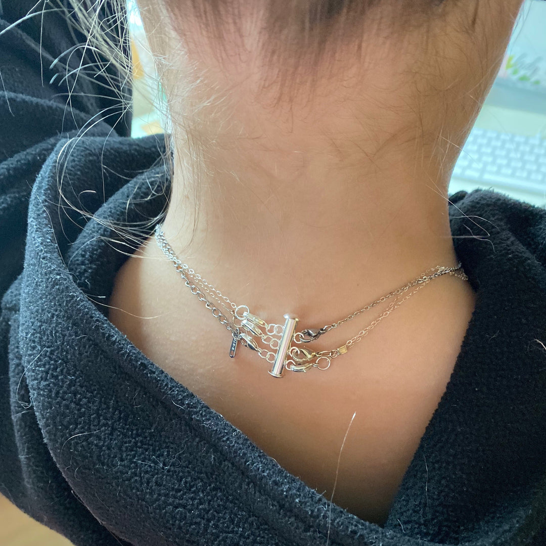 Silver Necklace Spacer Tube For Three Necklaces, our necklace spacer lets you layer three necklaces without tangling. It has three small silver-plated lobster clasps 