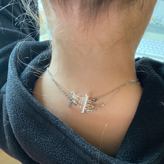 Silver Necklace Spacer Tube For Three Necklaces, our necklace spacer lets you layer three necklaces without tangling. It has three small silver-plated lobster clasps 
