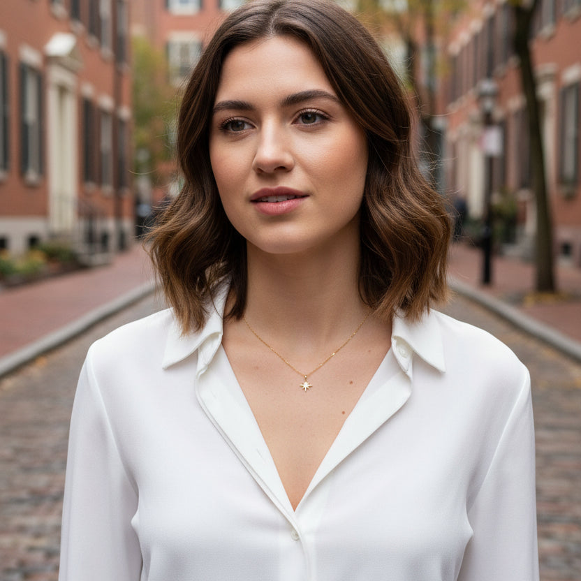 14K Gold Eight Point Star Charm Necklace, our dainty gold star necklace has an eight-point star charm with a cubic zirconia center on a 14k gold-filled chain