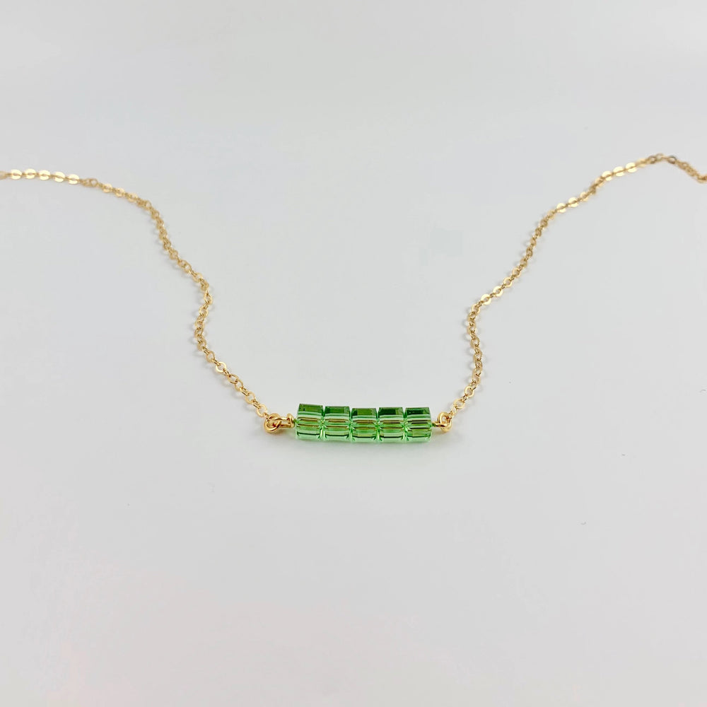 Peridot Green Crystal Cube Bar Necklace Charm Jewelry, styled as a minimalist crystal cube bar necklace featuring 5 mini facetted cubes i