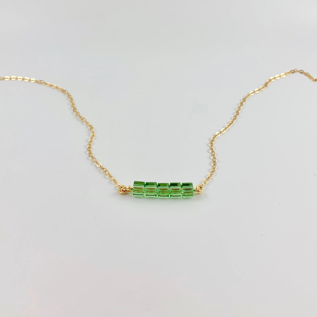 Peridot Green Crystal Cube Bar Necklace Charm Jewelry, styled as a minimalist crystal cube bar necklace featuring 5 mini facetted cubes i