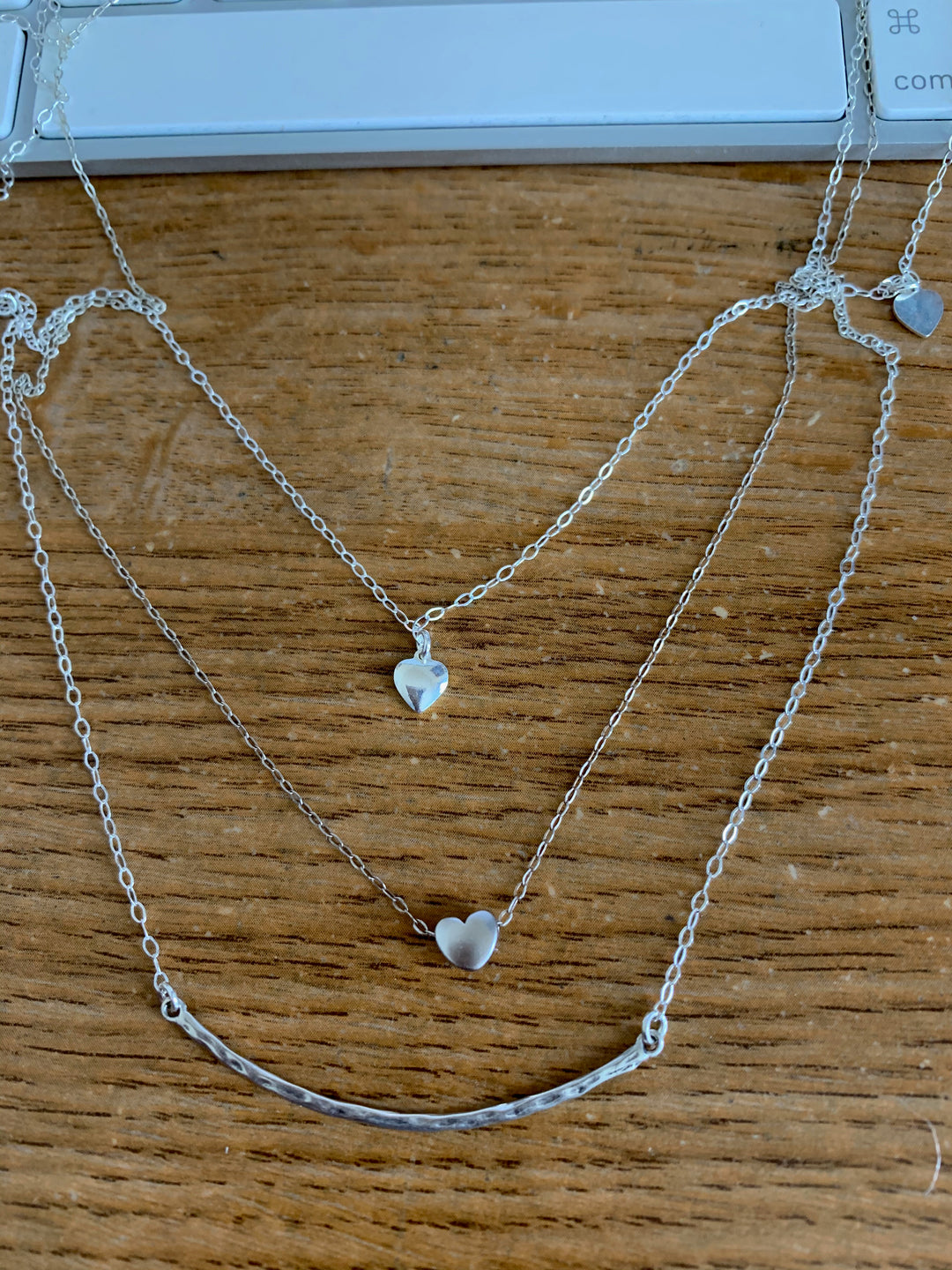 Silver Necklace Spacer Tube For Three Necklaces, our necklace spacer lets you layer three necklaces without tangling. It has three small silver-plated lobster clasps 