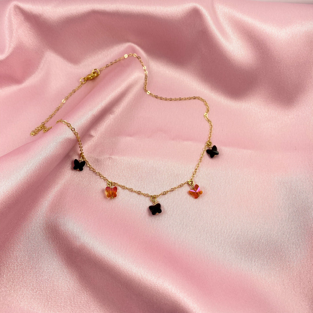 Black & Astral Pink Crystal Butterfly Choker Necklace, Add a touch of charm with the Black & Astral Pink Butterfly Choker Necklace, a delightful chain of crystal butterflies 