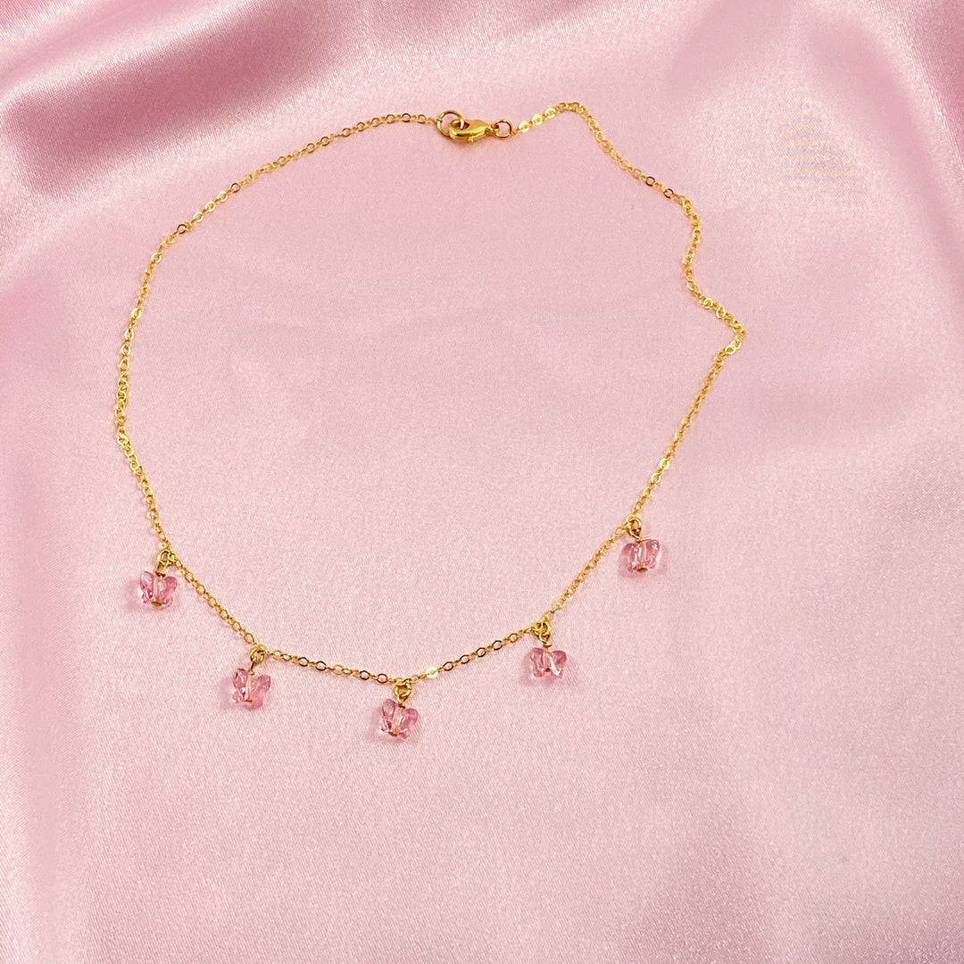 Pink Butterfly Choker Necklace,  Add a touch of charm with the Pink Butterfly Choker Necklace, a delightful chain of crystal butterflies crafted by hand