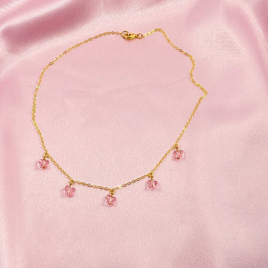 Pink Butterfly Choker Necklace,  Add a touch of charm with the Pink Butterfly Choker Necklace, a delightful chain of crystal butterflies crafted by hand