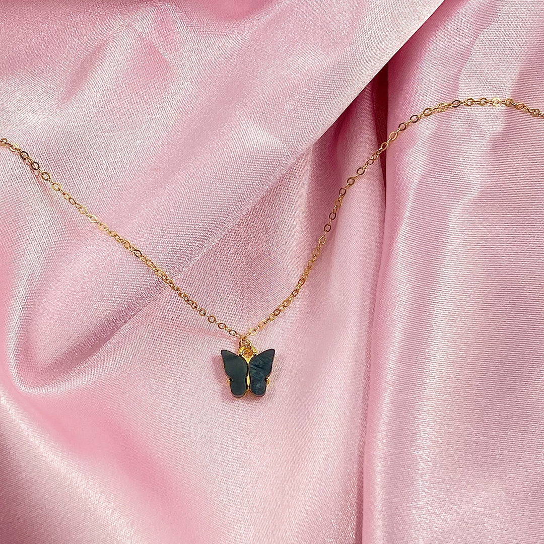 Black Pearl Butterfly Necklace, is perfect for adding a petite, minimalist charm to any look. Lightweight and eye-catching, the 14K gold filled chain and pearlized 