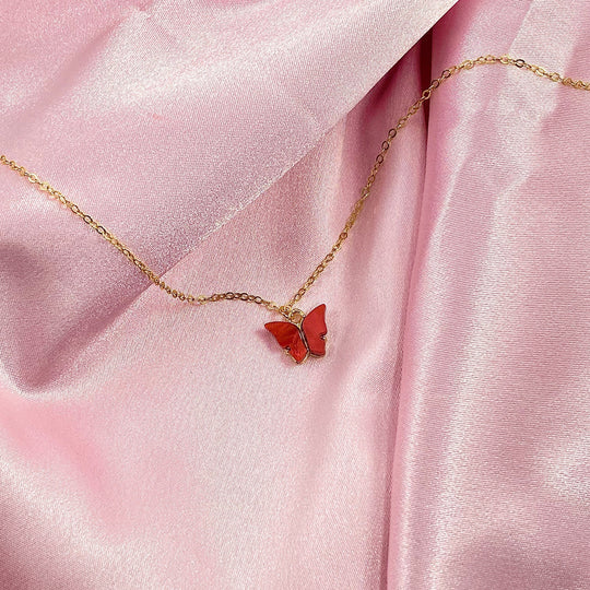 Ruby Red Pearl Butterfly Necklace, is perfect for adding a petite, minimalist charm to any look. Lightweight and eye-catching, the 14K gold filled chain 