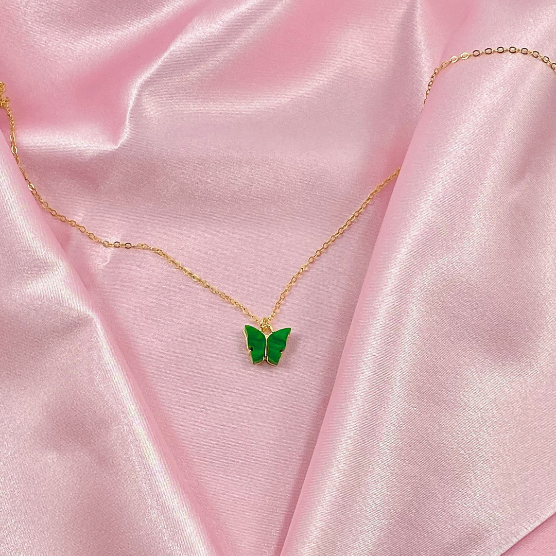 Emerald Green Pearl Butterfly Necklace, is perfect for adding a petite, minimalist charm to any look. Lightweight and eye-catching, the 14K gold filled chain
