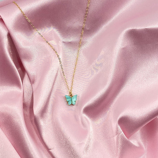 Light Blue Pearl Butterfly Necklace, is perfect for adding a petite, minimalist charm to any look. Lightweight and eye-catching, the 14K gold filled chain 