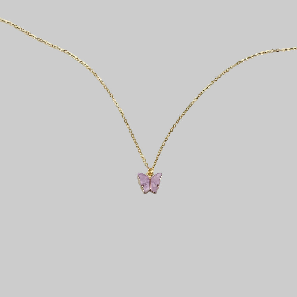 Lavender Pearl Butterfly Necklace, is perfect for adding a petite, minimalist charm to any look. Lightweight and eye-catching, the 14K gold chain a