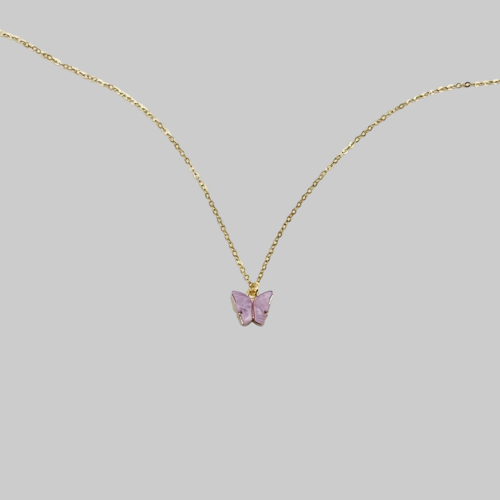 Lavender Pearl Butterfly Necklace, is perfect for adding a petite, minimalist charm to any look. Lightweight and eye-catching, the 14K gold chain a