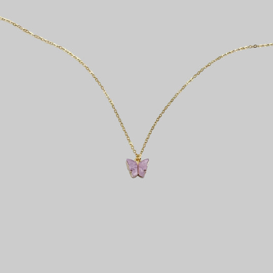 Lavender Pearl Butterfly Necklace, is perfect for adding a petite, minimalist charm to any look. Lightweight and eye-catching, the 14K gold chain a