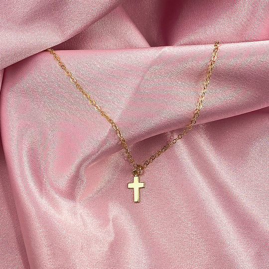 14K Tiny Gold Cross Charm Necklace, our tiny gold cross necklace features a dainty gold cross charm on 14k gold-filled chain, minimalist in style