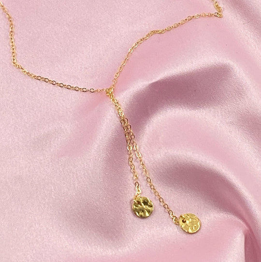 Gold Disk Charm Choker Necklace, has a minimalist vibe to it with two tiny hammered gold disks on 14k gold-filled chain. This unique blend of a faux lariat style and charm offer a intriguing piece of jewelry.