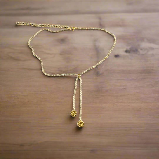 Gold Disk Charm Choker Necklace, has a minimalist vibe to it with two tiny hammered gold disks on 14k gold-filled chain. This unique blend of a faux lariat style and charm offer a intriguing piece of jewelry.