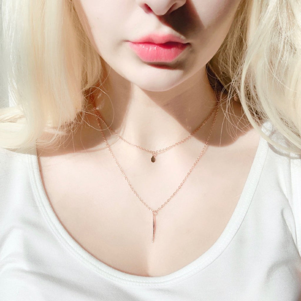 Rose Gold Needle Spike Charm Necklace, our dainty necklace features a minimalist rose gold needle spike charm suspended from a slender rose gold chain