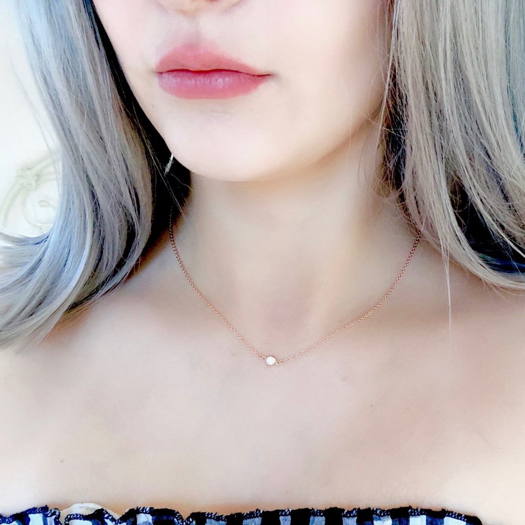 Rose Gold Cubic Zirconia Solitaire Necklace, this tiny rose gold cubic zirconia solitaire crystal charm in a rose gold bezel frame, offers a sweet & petite tiny sparkle on rose gold chain.