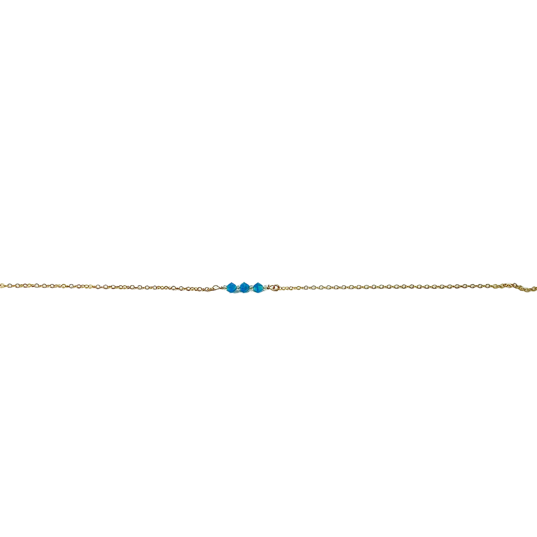 This Handmade Turquoise Blue Crystal Bar Necklace combines minimalist vibes with a boho twist. Featuring three dazzling crystals set on a 14k gold-filled chain