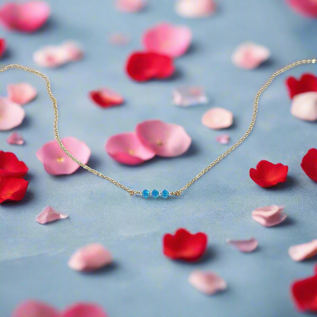 This Handmade Turquoise Blue Crystal Bar Necklace combines minimalist vibes with a boho twist. Featuring three dazzling crystals set on a 14k gold-filled chain