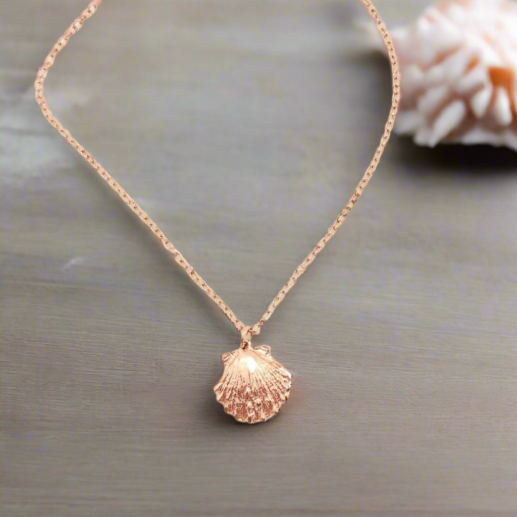 Rose Gold Mermaid Shell Charm Necklace, with it's textured surface, this vibrant rose gold mermaid clam shell sparkles in just the right places, it's beauty, on rose gold chain, makes a sweet treasure to adore.