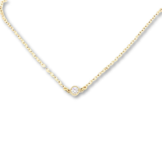 Tiny Cubic Zirconia Solitaire Necklace, this delicate necklace features a tiny 4mm cubic zirconia set on a slim 14K gold filled chain, adding a touch of sweet sparkle to your attire.