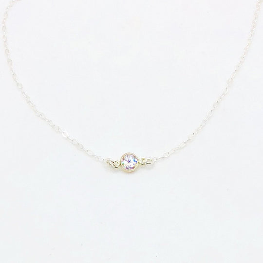 Sterling Silver Cubic Zirconia Solitaire Necklace, a tiny cubic zirconia crystal in a silver bezel frame on sterling silver chain, a sweet & petite charm necklace.
