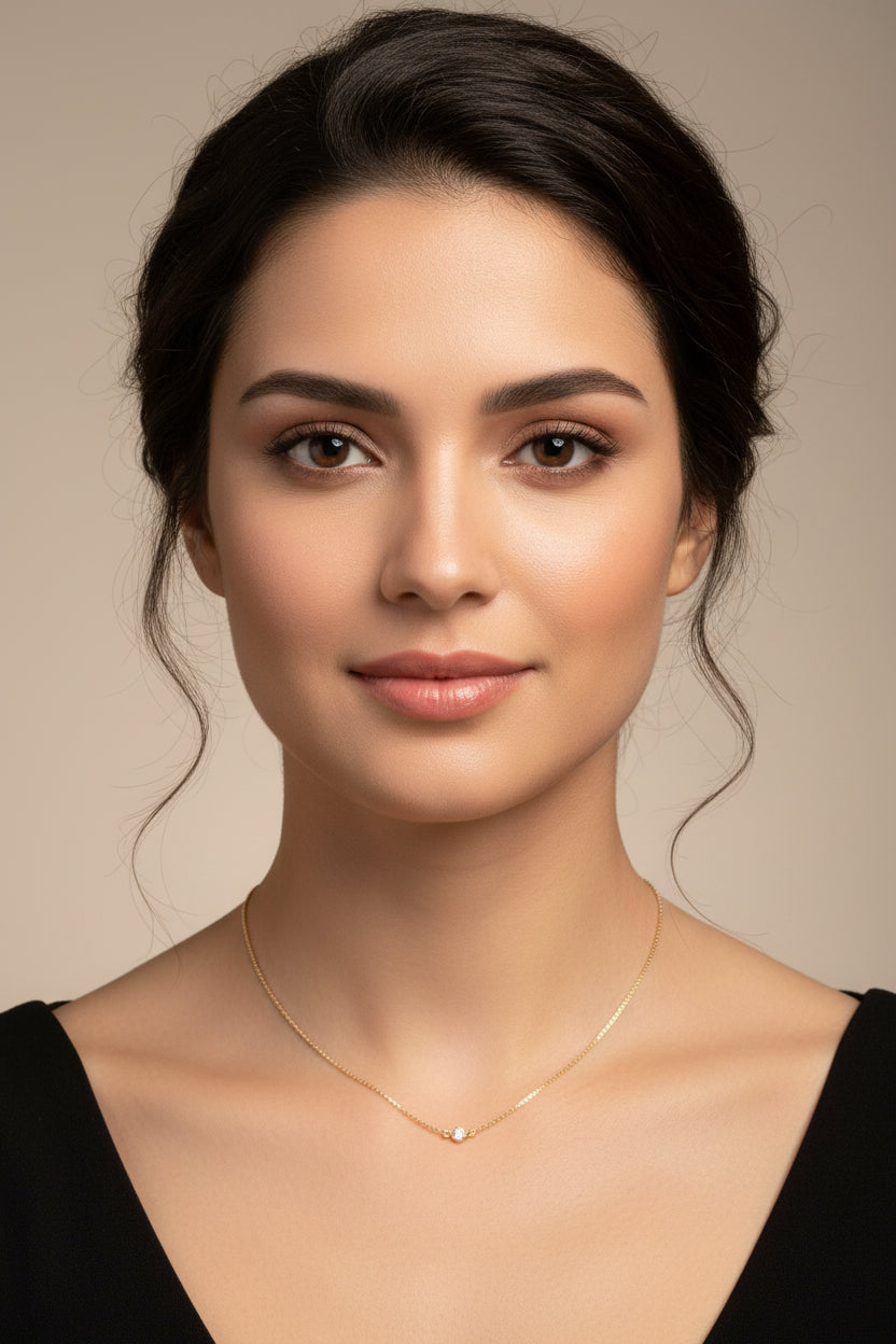 Tiny Cubic Zirconia Solitaire Necklace, this delicate necklace features a tiny 4mm cubic zirconia set on a slim 14K gold filled chain, adding a touch of sweet sparkle to your attire.