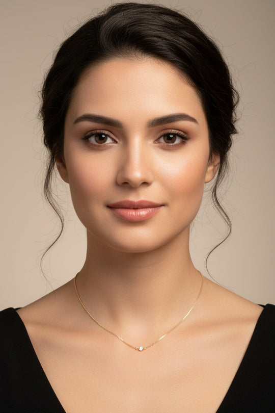 Tiny Cubic Zirconia Solitaire Necklace, this delicate necklace features a tiny 4mm cubic zirconia set on a slim 14K gold filled chain, adding a touch of sweet sparkle to your attire.
