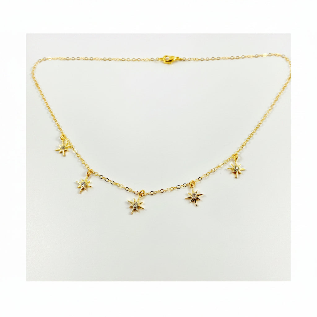 Tiny Star Charm Choker Necklace, hand crafted with tiny gold stars that have a sparkling cubic zirconia crystal center, on 14k gold-filled chain. A unique blend of a sweet & petite jewelry treasure.