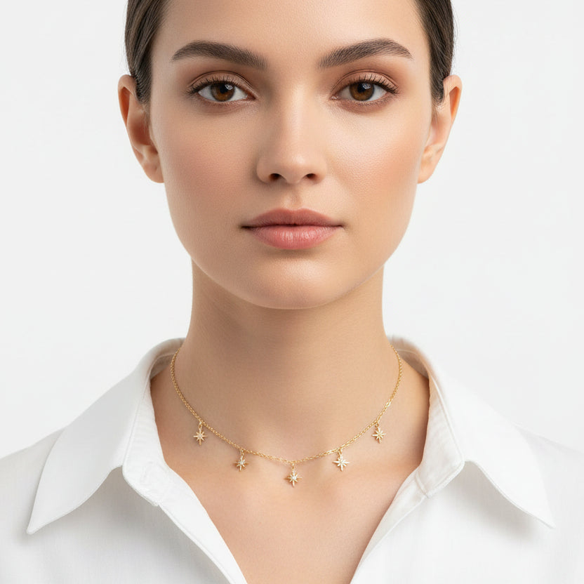 Tiny Star Charm Choker Necklace, hand crafted with tiny gold stars that have a sparkling cubic zirconia crystal center, on 14k gold-filled chain. A unique blend of a sweet & petite jewelry treasure.