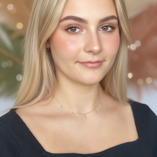 Tiny Star Charm Choker Necklace, hand crafted with tiny gold stars that have a sparkling cubic zirconia crystal center, on 14k gold-filled chain. A unique blend of a sweet & petite jewelry treasure.