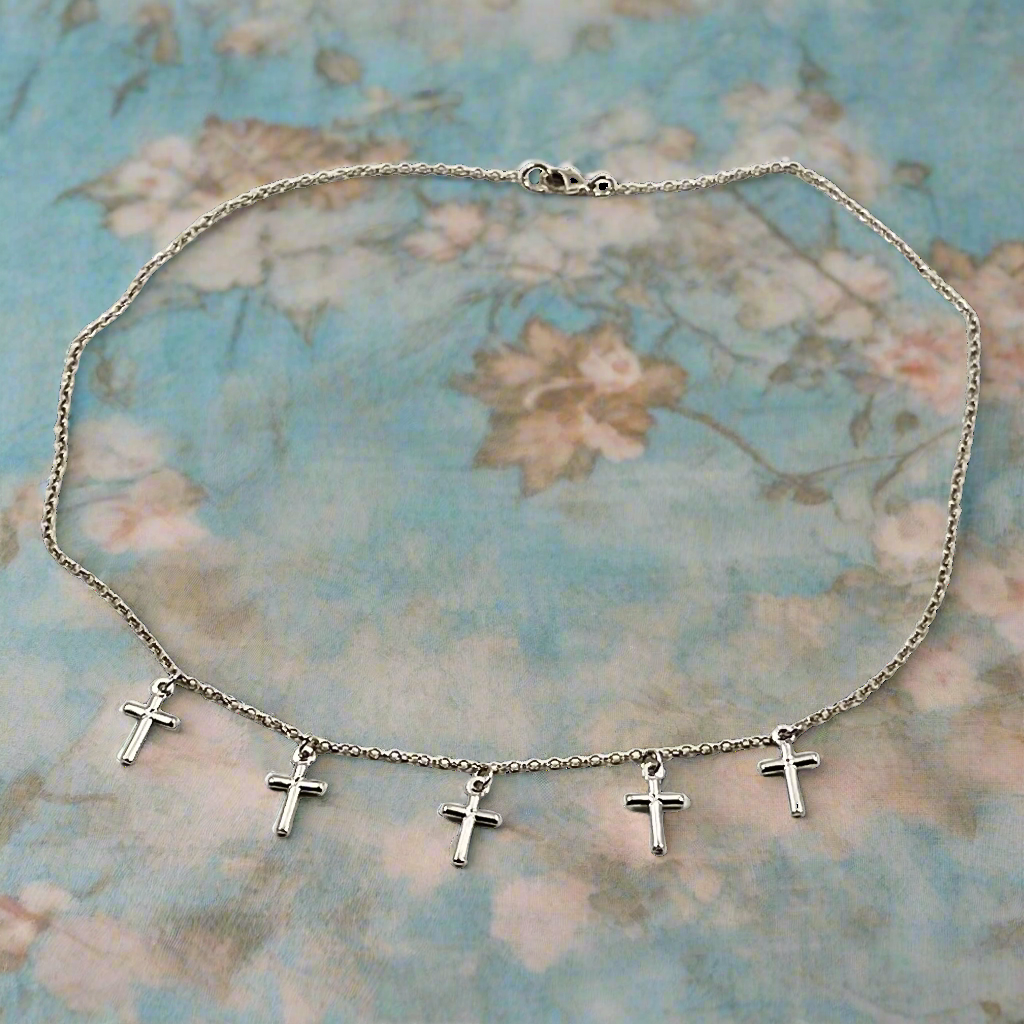 Silver Cross Choker Chain Necklace, made with sterling silver, our Silver Cross Choker Chain Necklace has a subtle dainty touch with tiny silver crosses, making it a unique blend of charm and grace.