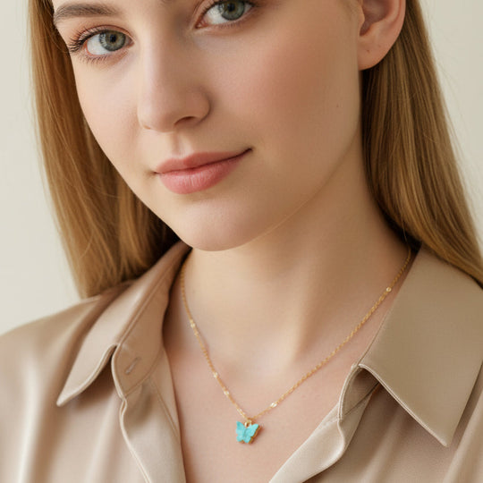 Light Blue Pearl Butterfly Necklace, is perfect for adding a petite, minimalist charm to any look. Lightweight and eye-catching, the 14K gold filled chain 