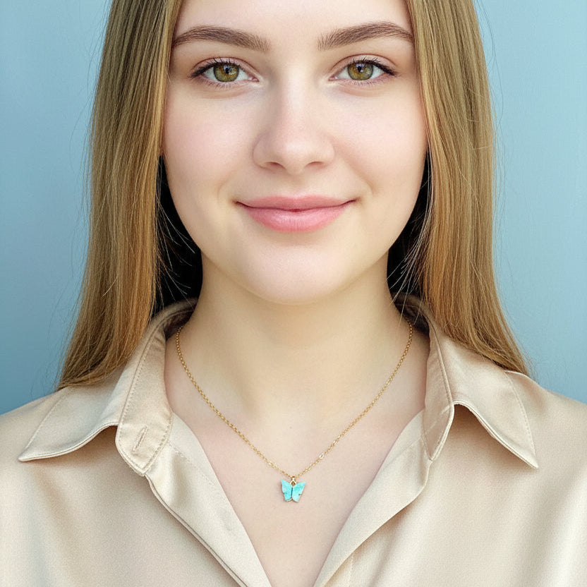 Light Blue Pearl Butterfly Necklace, is perfect for adding a petite, minimalist charm to any look. Lightweight and eye-catching, the 14K gold filled chain 