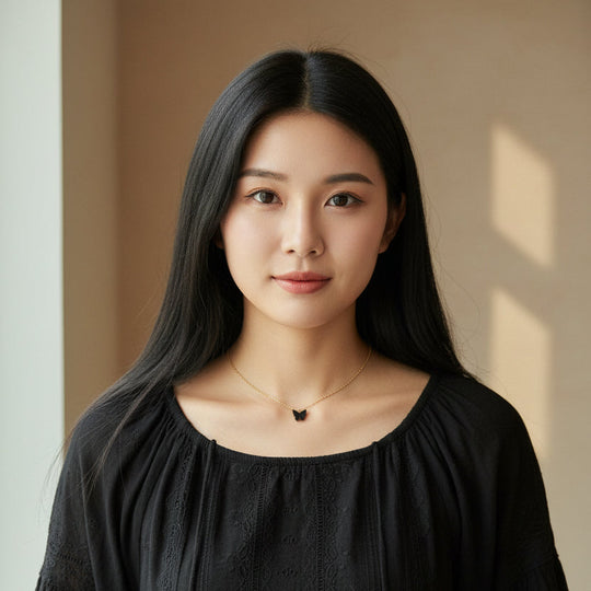 Black Pearl Butterfly Necklace, is perfect for adding a petite, minimalist charm to any look. Lightweight and eye-catching, the 14K gold filled chain and pearlized 