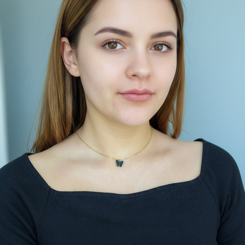 Black Pearl Butterfly Necklace, is perfect for adding a petite, minimalist charm to any look. Lightweight and eye-catching, the 14K gold filled chain and pearlized 