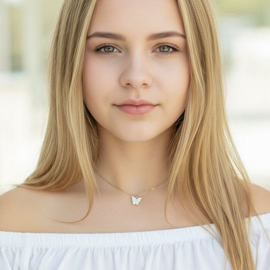 White Pearl Butterfly Necklace is perfect for adding a petite, minimalist charm to any look. Lightweight and eye-catching, the 14K gold chain 
