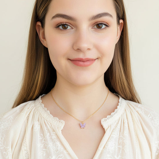 Lavender Pearl Butterfly Necklace, is perfect for adding a petite, minimalist charm to any look. Lightweight and eye-catching, the 14K gold chain a
