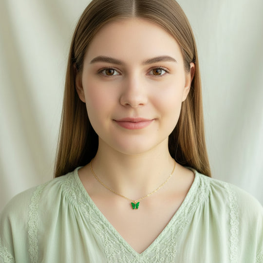 Emerald Green Pearl Butterfly Necklace, is perfect for adding a petite, minimalist charm to any look. Lightweight and eye-catching, the 14K gold filled chain