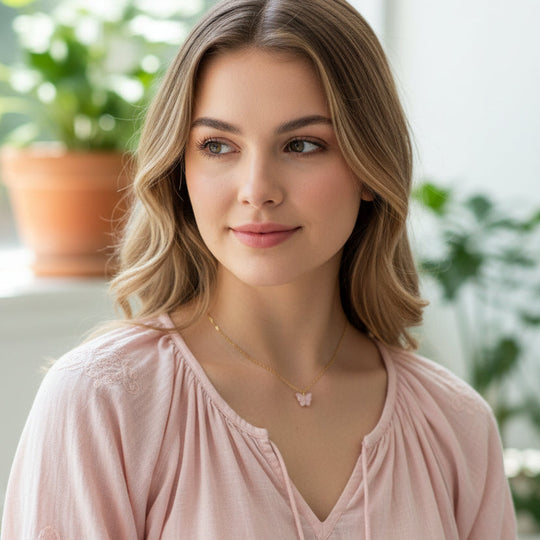Pink Pearl Butterfly Necklace, is perfect for adding a petite, minimalist charm to any look. Lightweight and eye-catching, the 14K gold filled chain 