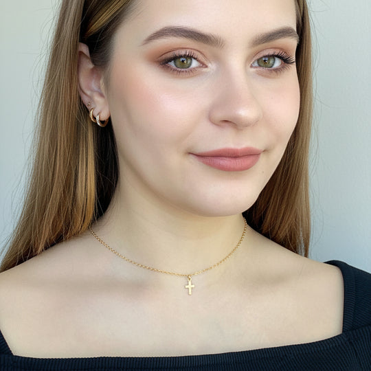 14K Tiny Gold Cross Charm Necklace, our tiny gold cross necklace features a dainty gold cross charm on 14k gold-filled chain, minimalist in style