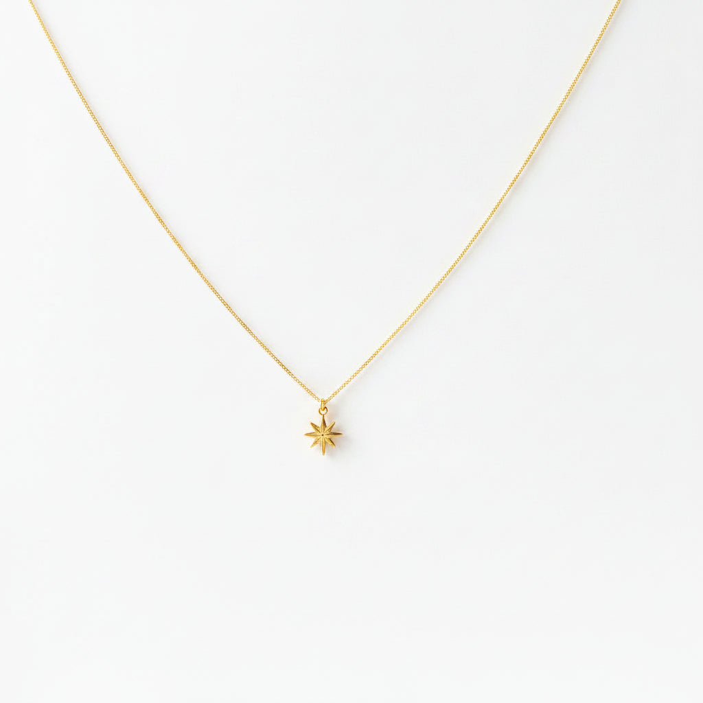 14K Gold North Star Charm Necklace, our eight-point North Star Charm Necklace has a tiny gold 8 point star charm on 14k gold-filled chain, it's a charming 