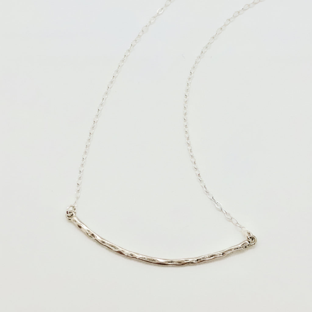 Silver Curved Skinny Bar Necklace, our delicate sterling silver necklace with a hand crafted hammered curved skinny bar on sterling silver chain, minimalist style charm necklace.